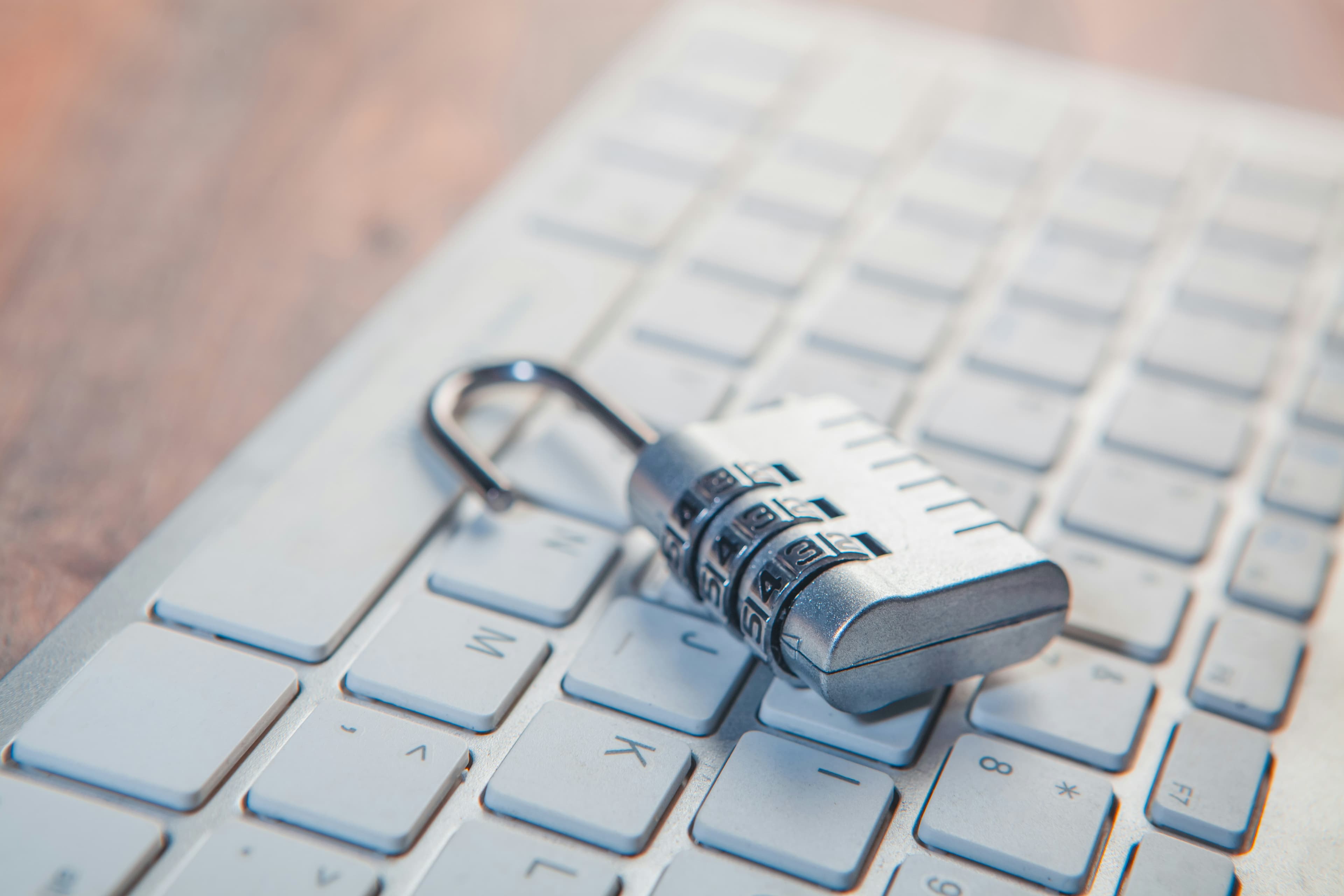 A combination lock resting on a computer keyboard